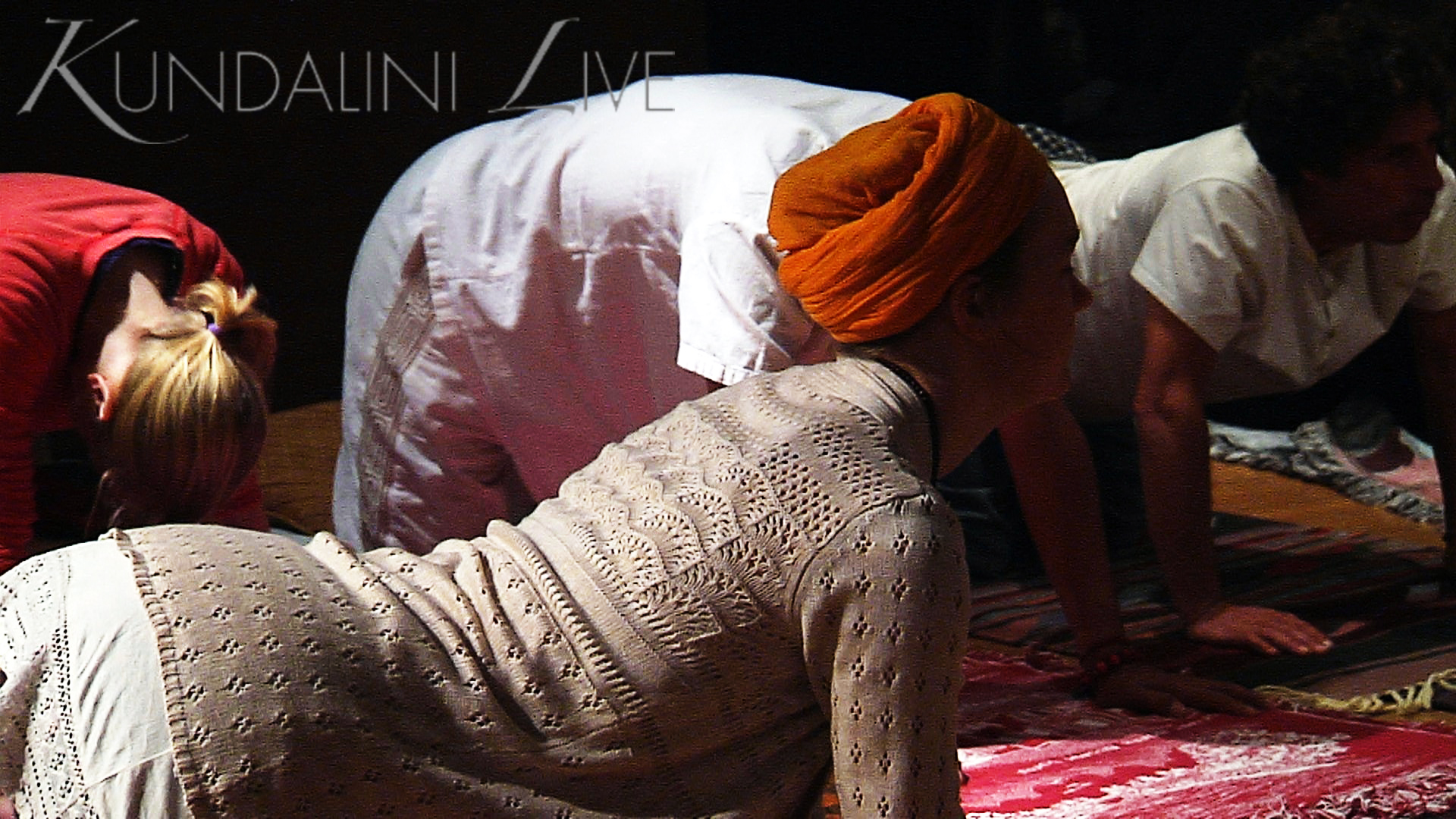 girl in orange turban doing dynamic cat cow hatha yoga posture for wellness happiness and peace of mind